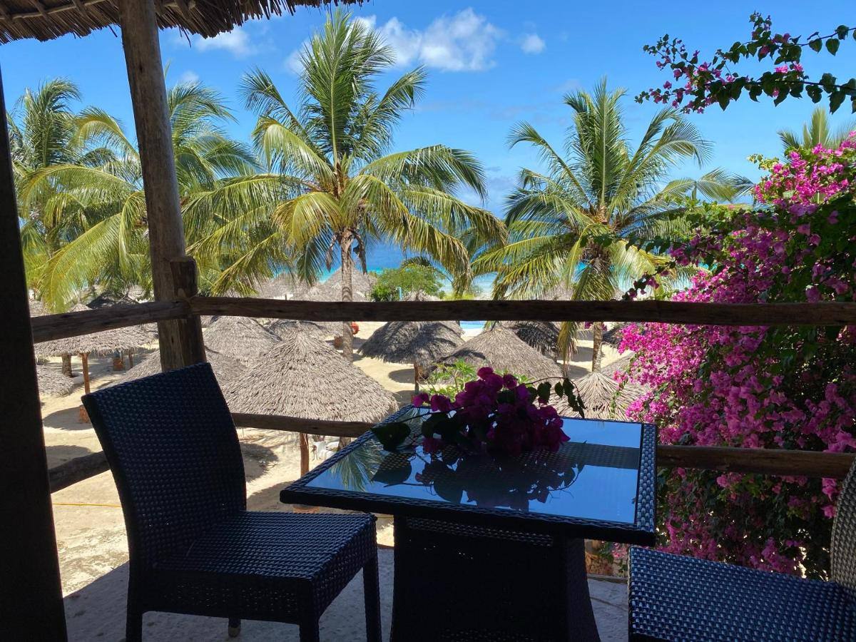 Luxury Villa terrace framed by bougainvillea with a sea view